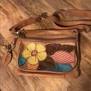 Fossil purse with floral patches